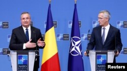 Прэм'ер-міністар Румыніі Нікаляе Чукэ і генэральны сакратар NATO Енс Столтэнбэрг. Ілюстрацыйнае фота