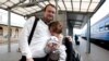 Ales Mikhalevich meets with his wife Milana and his daughter at the train station in Vilnius. 2011 (Photo by Julia Darashkevich)