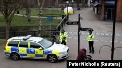 Britain - Police officers continue to guard the scene where a forensic tent in the centre of Salisbury