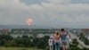 RUSSIA -- A family watches explosions at a military ammunition depot near the city of Achinsk in eastern Siberia's Krasnoyarsk region, in Achinsk, August 5, 2019