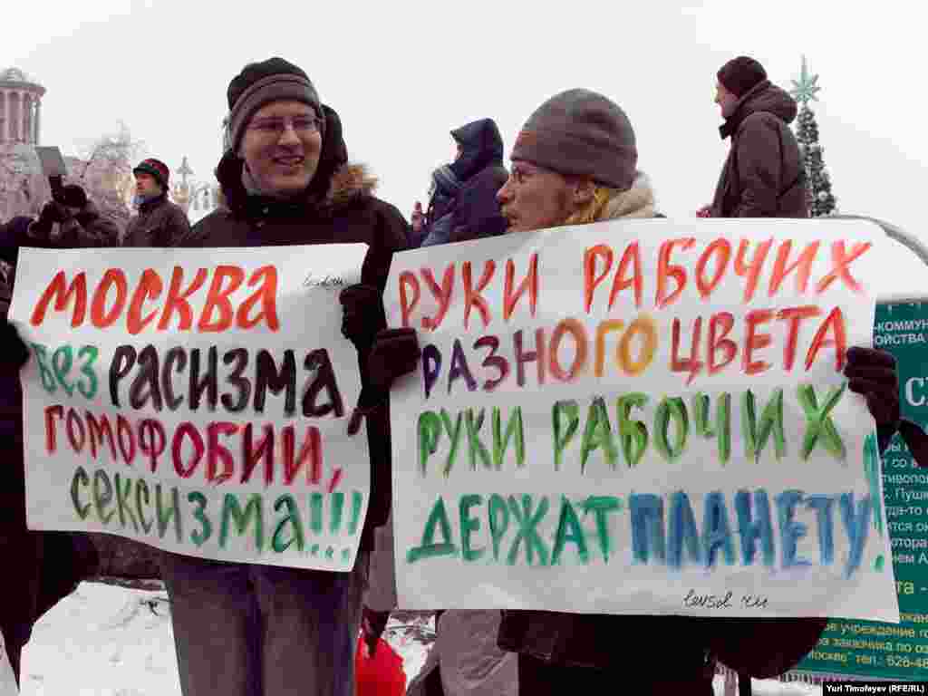 "Moscow without racism, homophobia, and sexism" (left) and, "Hands off workers of different colors. Support the planet."