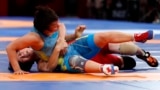 Indonesia-Wrestling - 2018 Asian Games – Women's Freestyle 53 kg Gold Medal Final - JCC – Assembly Hall - Jakarta, Indonesia – August 20, 2018 – Pak Yong Mi of North Korea in action with Zhuldyz Eshimova of Kazakhstan. REUTERS/Issei Kato