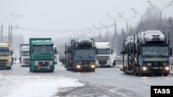 Trucks wait on the Belarusian-Russian border, December 8, 2014