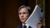 U.S. -- U.S. Secretary of State Antony Blinken holds up documents as he testifies during a Senate Foreign Relations Committee hearing to examine the United States withdrawal from Afghanistan, on Capitol Hill in Washington, September 14, 2021