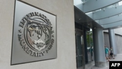 The seal of the International Monetary Fund is seen on a headquarters building in Washington