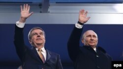 Томас Бах и Владимир Путин на открытии Олимпиады в Сочи 2014 г. 