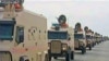 Bahrain -- A contingent of Gulf troops arrive in the unrest-wracked Kingdom of Bahrain across a causeway from Saudi Arabia, 14Mar2011